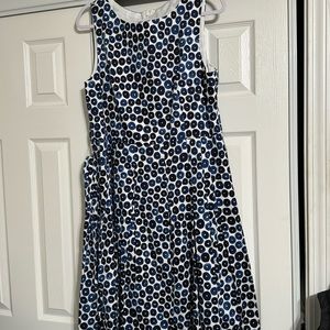 Blue and white sleeveless dress with sash and back zipper with a white lining.